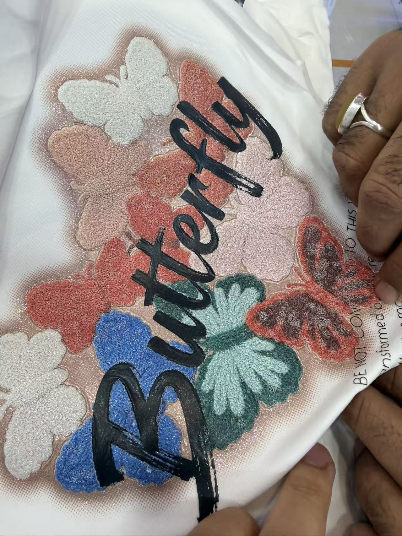 Embroidered butterflies on fabric